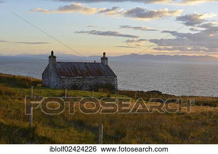 Evening view on the Isle of Skye on a single track road with an old Scottish stone house, Melvaig, Gairloch, Western Ross, Scotland, United Kingdom, Europe View Large Photo Image Stock Photograph - Evening view on the Isle of Skye on a single track road with an old Scottish stone house, Melvaig, Gairloch, Western Ross, Scotland, United Kingdom, Europe. Fotosearch