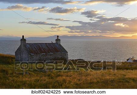 Evening view on the Isle of Skye on a single track road with an old Scottish stone house, Melvaig, Gairloch, Western Ross, Scotland, United Kingdom, Europe View Large Photo Image Stock Photography - Evening view on the Isle of Skye on a single track road with an old Scottish stone house, Melvaig, Gairloch, Western Ross, Scotland, United Kingdom, Europe. Fotosearch