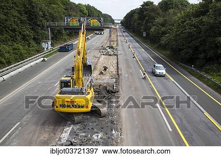 "Excavator, motorway construction site on the A52 motorway, Ratingen, North Rhine-Westphalia, Germany, Europe" View Large Photo Image Stock Photo - "Excavator, motorway construction site on the A52 motorway, Ratingen, North Rhine-Westphalia, Germany, Europe". Fotosearch
