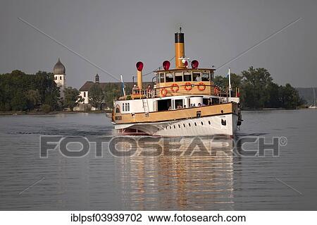 "Excursion boat and the monastery of Frauenchiemsee island, Chiemgau, Upper Bavaria, Bavaria, Germany, Europe" View Large Photo Image Stock Image - "Excursion boat and the monastery of Frauenchiemsee island, Chiemgau, Upper Bavaria, Bavaria, Germany, Europe". Fotosearch