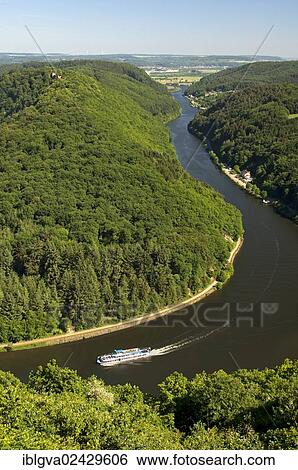 "Excursion boat cruising on one arm of the big loop of the Saar river near Mettlach, Saarland, Germany, Europe" View Large Photo Image Stock Photograph - "Excursion boat cruising on one arm of the big loop of the Saar river near Mettlach, Saarland, Germany, Europe". Fotosearch