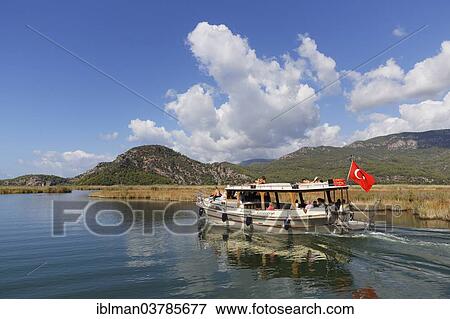 "Excursion boat in the Dalyan Delta, Dalyan, Mugla Province, Turkish Riviera or Turquoise Coast, Aegean, Turkey, Asia" View Large Photo Image Stock Photo - "Excursion boat in the Dalyan Delta, Dalyan, Mugla Province, Turkish Riviera or Turquoise Coast, Aegean, Turkey, Asia". Fotosearch