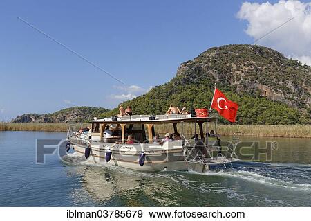 Stock Photo - "Excursion boat in the Dalyan Delta, Dalyan, Mugla Province, Turkish Riviera or Turquoise Coast, Aegean, Turkey, Asia". Fotosearch