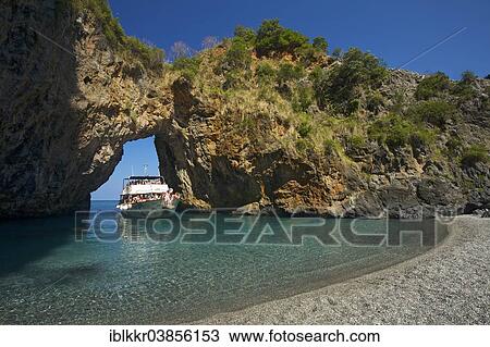 "Excursion boat, natural arch, Arco Magno, San Nicola Arcella, Capo Scalea, Calabria, Italy, Europe" View Large Photo Image Stock Image - "Excursion boat, natural arch, Arco Magno, San Nicola Arcella, Capo Scalea, Calabria, Italy, Europe". Fotosearch
