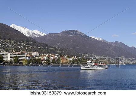 Stock Photo - "Excursion boat on Lake Maggiore with the city of Locarno, Ticino, Switzerland, Europe". Fotosearch