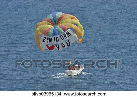 "Excursion boat with paraglider, labeled " Benidorm loves you", Playa Levante, Benidorm, Costa Blanca, Spain, Europe" View Large Photo Image Picture - "Excursion boat with paraglider, labeled " Benidorm loves you", Playa Levante, Benidorm, Costa Blanca, Spain, Europe". Fotosearch