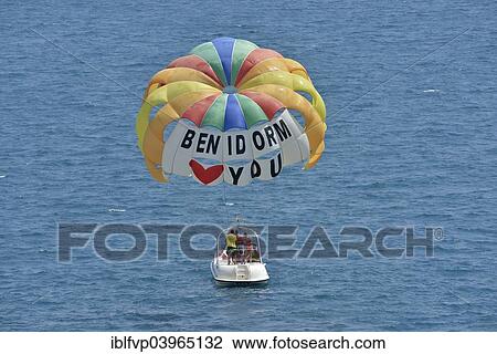 "Excursion boat with paraglider, labeled " Benidorm loves you", Playa Levante, Benidorm, Costa Blanca, Spain, Europe" View Large Photo Image Stock Image - "Excursion boat with paraglider, labeled " Benidorm loves you", Playa Levante, Benidorm, Costa Blanca, Spain, Europe". Fotosearch