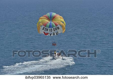 Stock Photography - "Excursion boat with paraglider, labeled &quot; Benidorm loves you&quot;, Playa Levante, Benidorm, Costa Blanca, Spain, Europe". Fotosearch