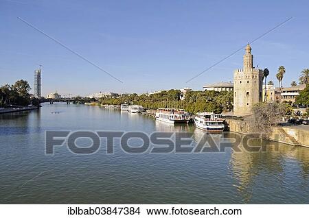 "Excursion boats on the bank of the Guadalquivir River, Torre del Oro, Gold Tower, maritime museum, Seville, Andalusia, Spain, Europe" View Large Photo Image Picture - "Excursion boats on the bank of the Guadalquivir River, Torre del Oro, Gold Tower, maritime museum, Seville, Andalusia, Spain, Europe". Fotosearch