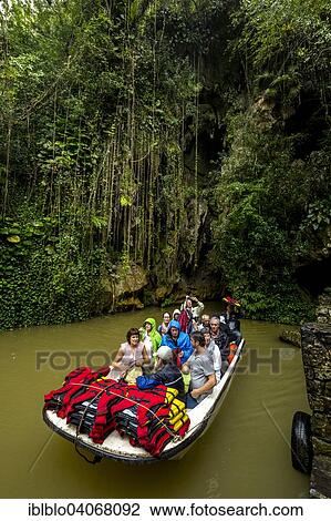 "Exit of the cave system, tourists in an electric boat, caves of the Indios, Cueva del Indio, underground caves with a river, Vinales, Cuba, North America" View Large Photo Image Stock Image - "Exit of the cave system, tourists in an electric boat, caves of the Indios, Cueva del Indio, underground caves with a river, Vinales, Cuba, North America". Fotosearch