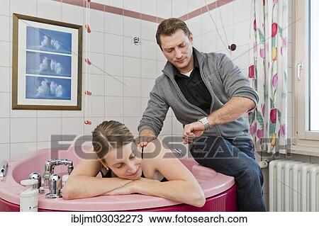 "Expectant father looking annoyed at his watch while his wife is resting in a break between contractions, Germany, Europe" View Large Photo Image Stock Image - "Expectant father looking annoyed at his watch while his wife is resting in a break between contractions, Germany, Europe". Fotosearch