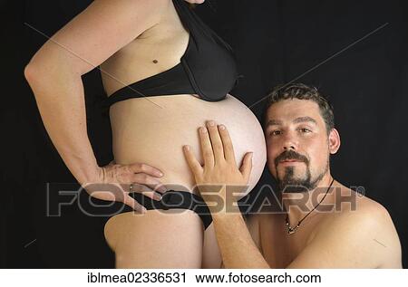 "Expectant parents, man listening to the belly of a pregnant woman" View Large Photo Image Stock Image - "Expectant parents, man listening to the belly of a pregnant woman". Fotosearch