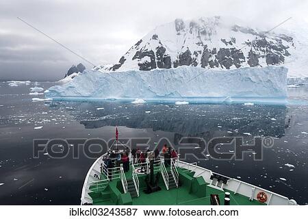 Stock Photo - "Expedition cruise ship, MS Expedition, in front of an iceberg, Errera Channel, Arctowski Peninsula, Antarctic Peninsula, Antarctica". Fotosearch