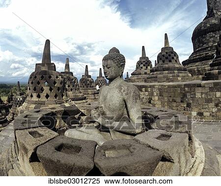 Stock Photography - "Exposed Buddha statue in the temple complex of Borobudur, stupas, UNESCO World Cultural Heritage Site, Borobudur, Yogyakarta, Java, Indonesia, Asia". Fotosearch