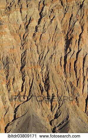 "Exposed fissured bedrock of orange-colored conglomerate on the crater wall of Ubehebe Crater, Death Valley, Death Valley National Park, California, USA" View Large Photo Image Stock Image - "Exposed fissured bedrock of orange-colored conglomerate on the crater wall of Ubehebe Crater, Death Valley, Death Valley National Park, California, USA". Fotosearch