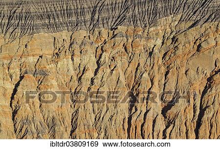 "Exposed fissured bedrock of orange-colored conglomerate on the crater wall of Ubehebe Crater, Death Valley, Death Valley National Park, California, USA" View Large Photo Image Stock Photo - "Exposed fissured bedrock of orange-colored conglomerate on the crater wall of Ubehebe Crater, Death Valley, Death Valley National Park, California, USA". Fotosearch