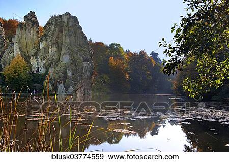 "Externsteine ​​rock formation in autumn, Horn-Bad Meinberg, North Rhine-Westphalia, Germany, Europe" View Large Photo Image Stock Photo - "Externsteine ​​rock formation in autumn, Horn-Bad Meinberg, North Rhine-Westphalia, Germany, Europe". Fotosearch
