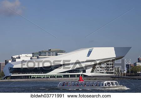 "Eye film museum, in front a canal boat, Amsterdam, North Holland province, Netherlands" View Large Photo Image Stock Image - "Eye film museum, in front a canal boat, Amsterdam, North Holland province, Netherlands". Fotosearch