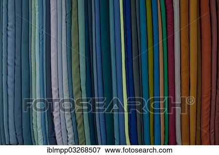 Stock Photo - "Fabrics lined up on a rack, Varkala, Kerala, India, Asia". Fotosearch
