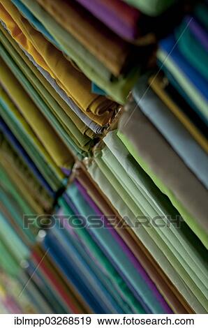 Stock Photo - "Fabrics lined up on a rack, Varkala, Kerala, India, Asia". Fotosearch