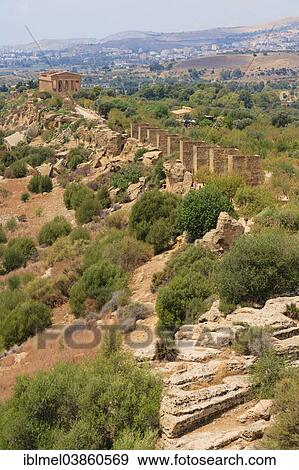 "Fabrizio Plessi Monumenta"""" and The Temple of Concordia or Harmonia, Akragas, The Valle dei Templi, Valley of the Temples, or Vaddi di li Tempri, Agrigento, Sicily, Italy, Europe" View Large Photo Image Stock Photo - "Fabrizio Plessi Monumenta"""" and The Temple of Concordia or Harmonia, Akragas, The Valle dei Templi, Valley of the Temples, or Vaddi di li Tempri, Agrigento, Sicily, Italy, Europe". Fotosearch