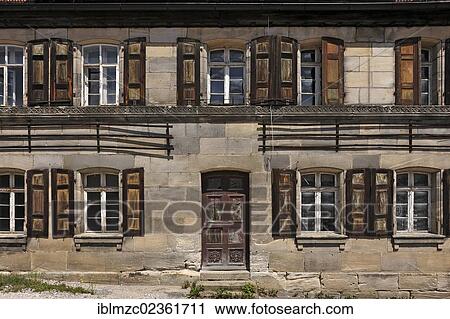 "Facade of a brownstone house built in the 18th century, under monumental protection, not yet restored, Bayreuther Strasse street 9, Schnaittach, Middle Franconia, Bavaria, Germany, Europe" View Large Photo Image Stock Image - "Facade of a brownstone house built in the 18th century, under monumental protection, not yet restored, Bayreuther Strasse street 9, Schnaittach, Middle Franconia, Bavaria, Germany, Europe". Fotosearch