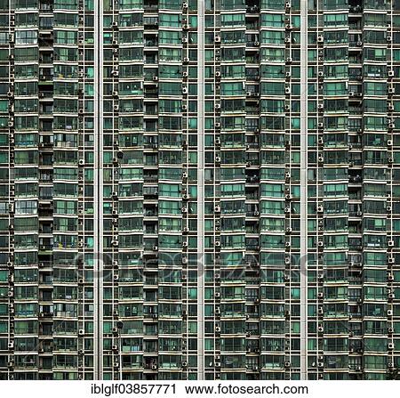 Stock Image - "Facade of a high-rise building with balconies and air conditioning units, Shanghai, China, Asia". Fotosearch