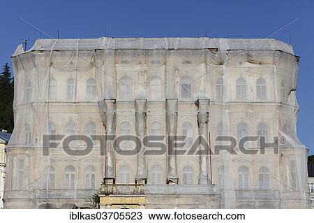 "Facade of a historic building shrouded with tarpaulins during renovation, Marianske Lazne, Karlovy Vary Region, Bohemia, Czech Republic, Europe" View Large Photo Image Stock Image - "Facade of a historic building shrouded with tarpaulins during renovation, Marianske Lazne, Karlovy Vary Region, Bohemia, Czech Republic, Europe". Fotosearch