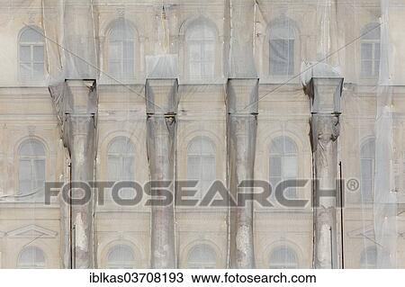"Facade of a historic building shrouded with tarpaulins during renovation, Marianske Lazne, Karlovy Vary Region, Bohemia, Czech Republic, Europe" View Large Photo Image Stock Image - "Facade of a historic building shrouded with tarpaulins during renovation, Marianske Lazne, Karlovy Vary Region, Bohemia, Czech Republic, Europe". Fotosearch