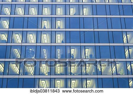 "Facade of a modern office building with lights on in the offices in the evening, Munich, Bavaria, Germany, Europe" View Large Photo Image Stock Image - "Facade of a modern office building with lights on in the offices in the evening, Munich, Bavaria, Germany, Europe". Fotosearch