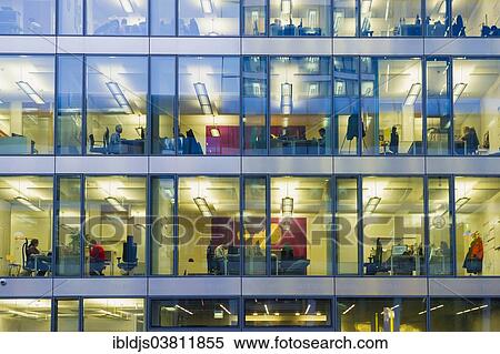 "Facade of a modern office building with lights on in the offices in the evening, Munich, Bavaria, Germany, Europe" View Large Photo Image Stock Photography - "Facade of a modern office building with lights on in the offices in the evening, Munich, Bavaria, Germany, Europe". Fotosearch