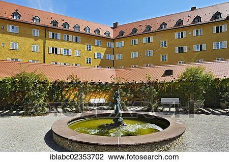 "Facade with a fountain in the Borstei, a heritage protected residential area in the district of Moosach, Munich, Bavaria, Germany, Europe" View Large Photo Image Stock Image - "Facade with a fountain in the Borstei, a heritage protected residential area in the district of Moosach, Munich, Bavaria, Germany, Europe". Fotosearch