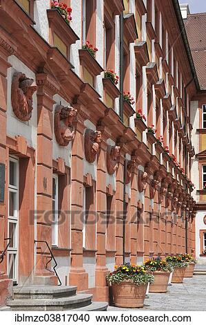 Stock Image - "Facade with ancient busts of emperors, gods and goddesses at the former Altes Schloss castle, 18th century, now tax office, Bayreuth, Bavaria, Germany, Europe". Fotosearch