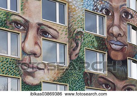 Stock Photograph - "Facade with faces of different nationalities, wall painting, mural, Dusseldorf, North Rhine-Westphalia, Germany, Europe". Fotosearch