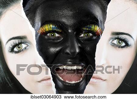 Stock Image - "Face of a laughing young woman painted with black facepaint looking through a torn portrait photo, Austria, Europe". Fotosearch