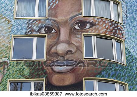 Stock Photo - "Face of an African person on a facade, wall painting, mural, Dusseldorf, North Rhine-Westphalia, Germany, Europe". Fotosearch