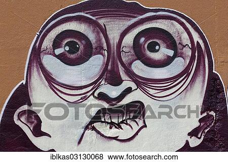 Stock Photo - "Face with large eyes, graffiti, Meiderich, Duisburg, Ruhr district, North Rhine-Westphalia, Germany, Europe". Fotosearch