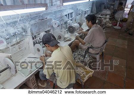 Stock Image - "Factory for the manufacture of jewelery and decoration from shells and partially protected species of coral, Vung Tao, Vietnam, Asia". Fotosearch