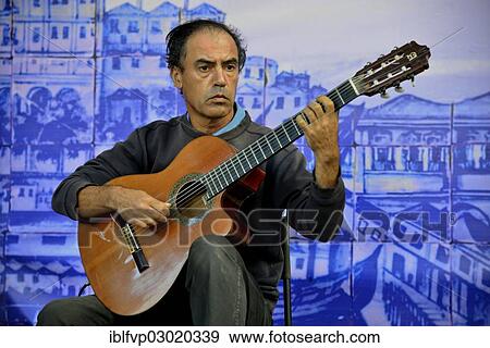 "Fado musician performing at a concert in Castelo de Sao Jorge Castle, Alfama, Lisbon, Lisbon District, Portugal, Europe" View Large Photo Image Stock Photo - "Fado musician performing at a concert in Castelo de Sao Jorge Castle, Alfama, Lisbon, Lisbon District, Portugal, Europe". Fotosearch