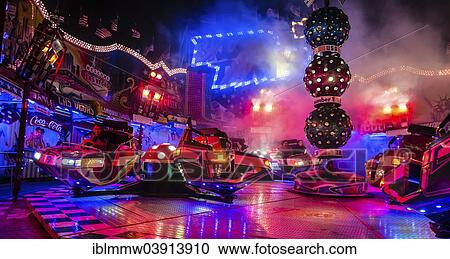 Stock Image - "Fair ride at night, Munich Spring Festival, Theresienwiese, Munich, Bavaria, Germany, Europe". Fotosearch