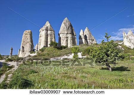 "Fairy Chimneys made of tufa in the Valley of Love near the World Heritage Site of Goereme, Love Valley, Goreme National Park, Cappadocia, Nevsehir Province, Central Anatolia Region, Turkey, Asia" View Large Photo Image Stock Photo - "Fairy Chimneys made of tufa in the Valley of Love near the World Heritage Site of Goereme, Love Valley, Goreme National Park, Cappadocia, Nevsehir Province, Central Anatolia Region, Turkey, Asia". Fotosearch
