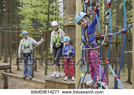 "Family climbing in a climbing park, Svaty Linhart, Karlovy Vary, Karlovy Vary Region, Bohemia, Czech Republic, Europe" View Large Photo Image Stock Photo - "Family climbing in a climbing park, Svaty Linhart, Karlovy Vary, Karlovy Vary Region, Bohemia, Czech Republic, Europe". Fotosearch