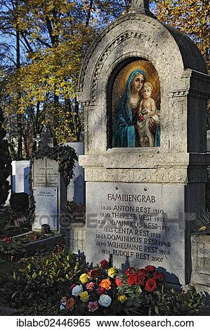 Stock Photography - "Family grave with mosaic and roses on the Ostfriedhof or East Cemetery, Munich, Bavaria, Germany, Europe". Fotosearch