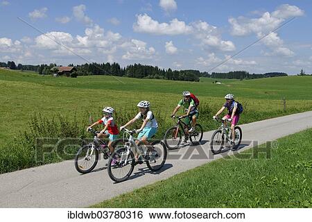 "Family on a bicycle tour, in Seeweiler, Seeg Ostallgaeu, Swabia, Bavaria, Germany, Europe" View Large Photo Image Stock Photograph - "Family on a bicycle tour, in Seeweiler, Seeg Ostallgaeu, Swabia, Bavaria, Germany, Europe". Fotosearch