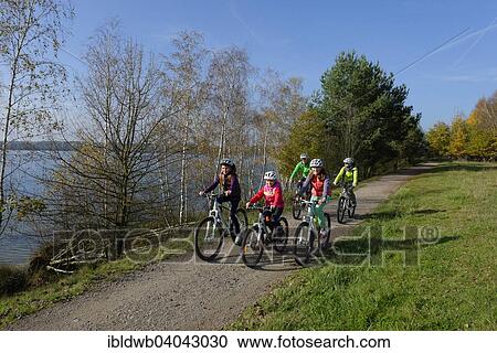 "Family on bicycle tour at Murner See lake, Upper Palatinate Lakeland, near Wackersdorf, Upper Palatinate, Bavaria, Germany, Europe" View Large Photo Image Stock Image - "Family on bicycle tour at Murner See lake, Upper Palatinate Lakeland, near Wackersdorf, Upper Palatinate, Bavaria, Germany, Europe". Fotosearch