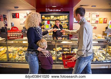 "Family shopping at the cheese counter in the supermarket, Germany, Europe" View Large Photo Image Stock Image - "Family shopping at the cheese counter in the supermarket, Germany, Europe". Fotosearch