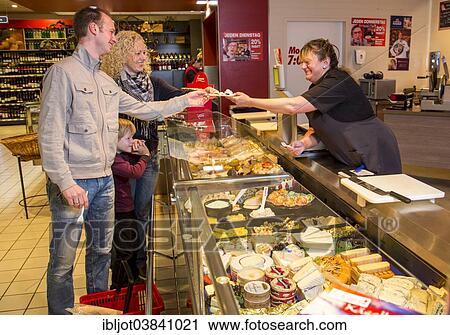 "Family shopping at the cheese counter in the supermarket, Germany, Europe" View Large Photo Image Stock Image - "Family shopping at the cheese counter in the supermarket, Germany, Europe". Fotosearch