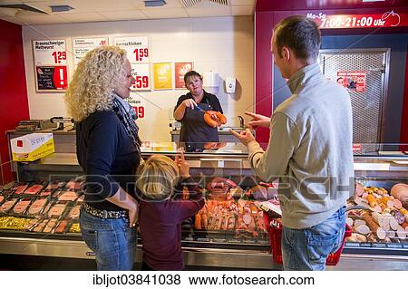 "Family shopping at the meat counter in a supermarket, Germany, Europe" View Large Photo Image Stock Photo - "Family shopping at the meat counter in a supermarket, Germany, Europe". Fotosearch