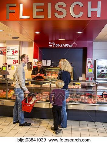"Family shopping at the meat counter in a supermarket, Germany, Europe" View Large Photo Image Stock Photo - "Family shopping at the meat counter in a supermarket, Germany, Europe". Fotosearch
