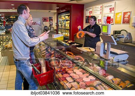 "Family shopping at the meat counter in a supermarket, Germany, Europe" View Large Photo Image Stock Photograph - "Family shopping at the meat counter in a supermarket, Germany, Europe". Fotosearch